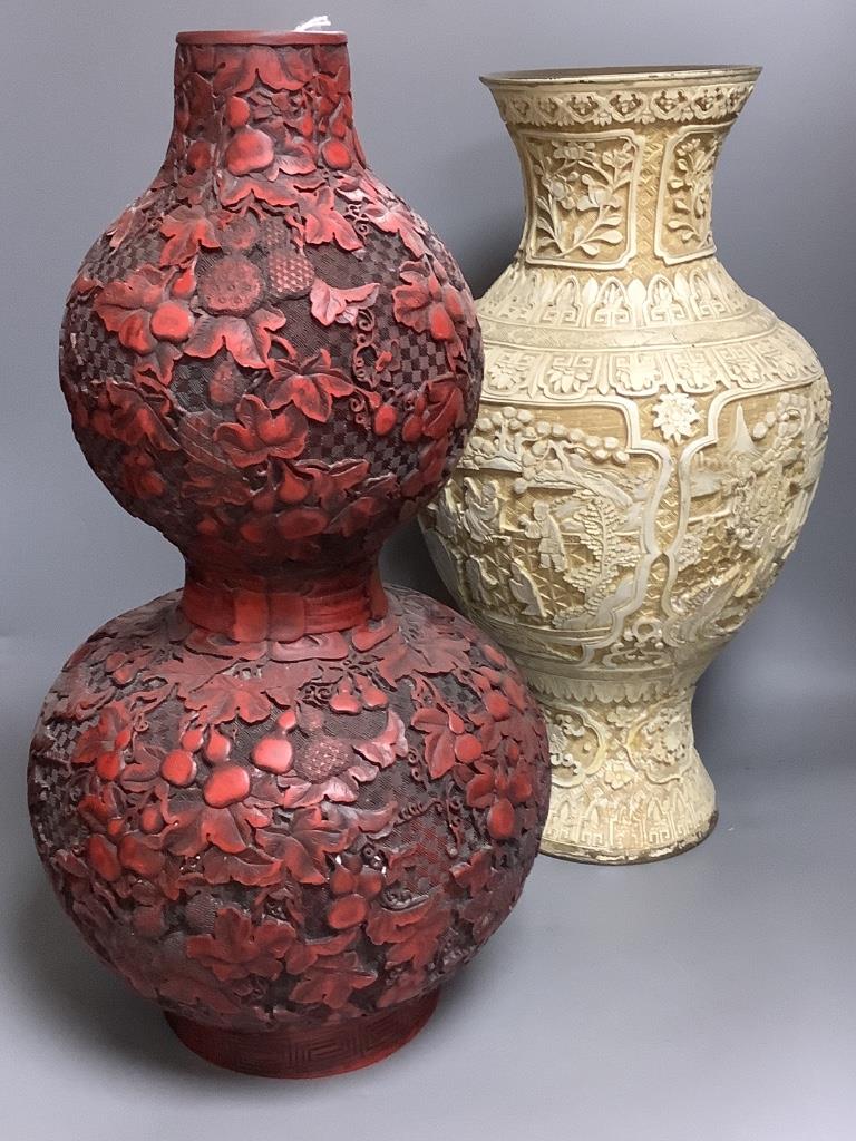 A simulated lacquer double-gourd vase and a simulated cream lacquer vase, tallest 48cm